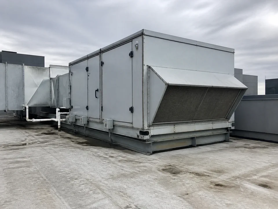 Fictional rooftop unit photograph for visual context only; not a measurement or diagnostic source.